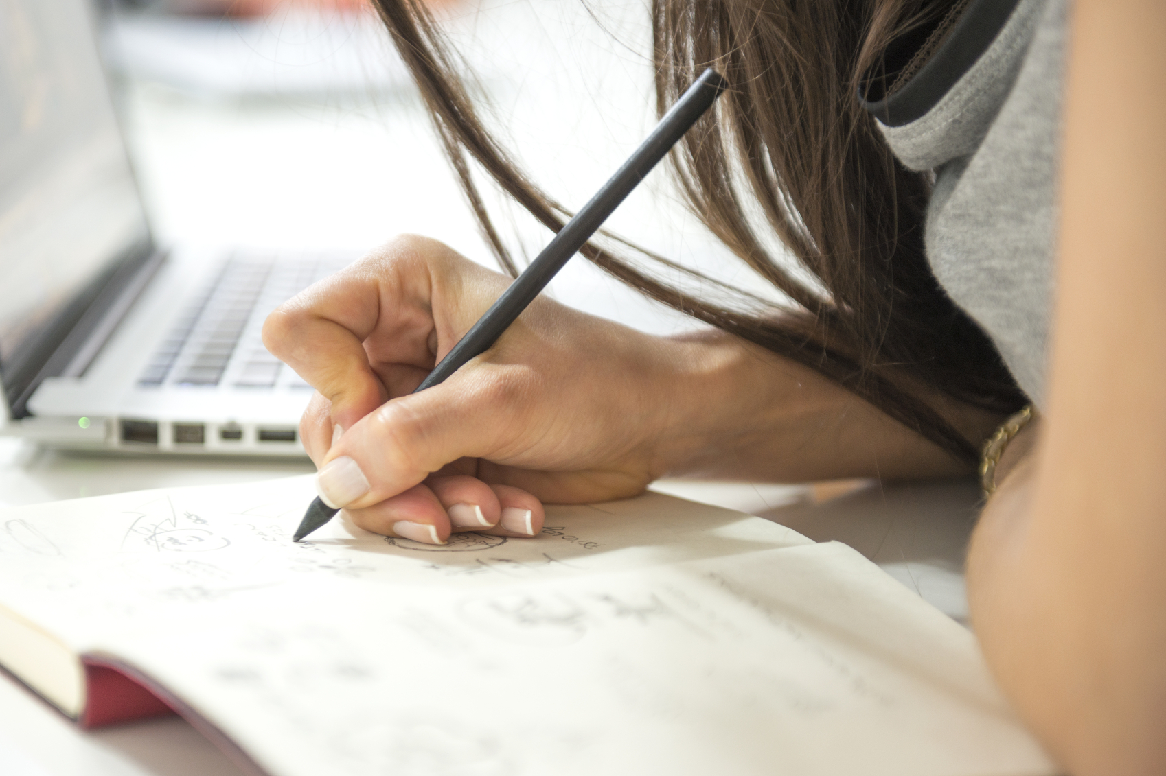 woman writing in a notebook