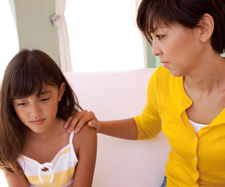 mother is consoling her daughter