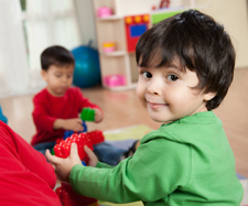 child playing with blocks in a child care