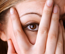 woman covering her face
